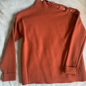 Rust/orange turtleneck sweater